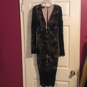 Black lace with Nude underlay  Bebe dress.